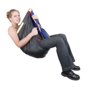 A woman sitting in a 328 RSI RESCUE TRIANGLE with her hands in her pockets.