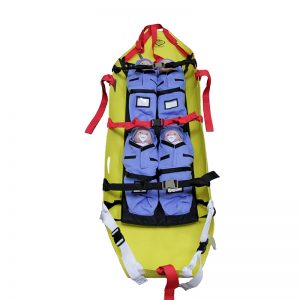 A yellow and blue Skedco Kiddie Litter Insert with HMH Sked® U.S. Pat. No. D781,187 stretcher with straps on it.