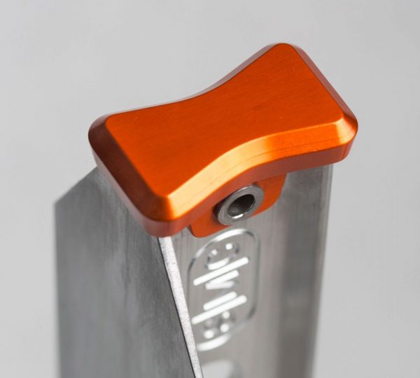 An orange Pro Picket bracket on a piece of metal.