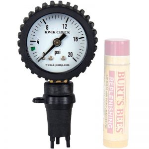 A K-Pump Pressure Gauge for Boston Valves and a tube of lip balm.