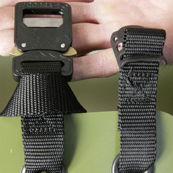 A person holding a black belt with a SKED-EVAC® Aluminum Side Release Buckle Conversion Kit on it.