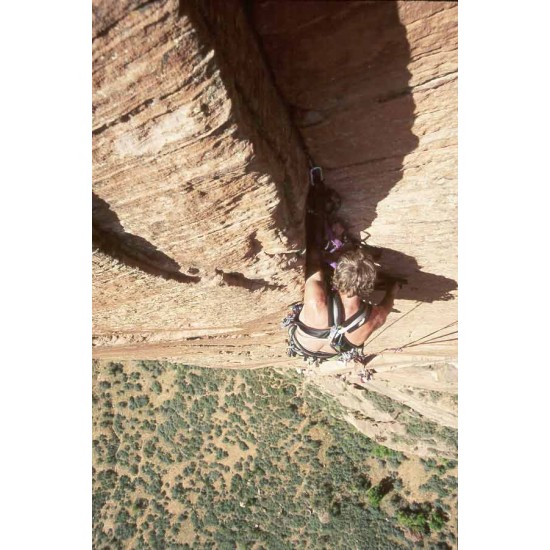 A woman is climbing up a 505 BIG WALL RACK.