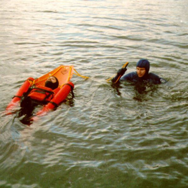 A man is floating in the water with Ethafoam Float Logs (pair) raft.