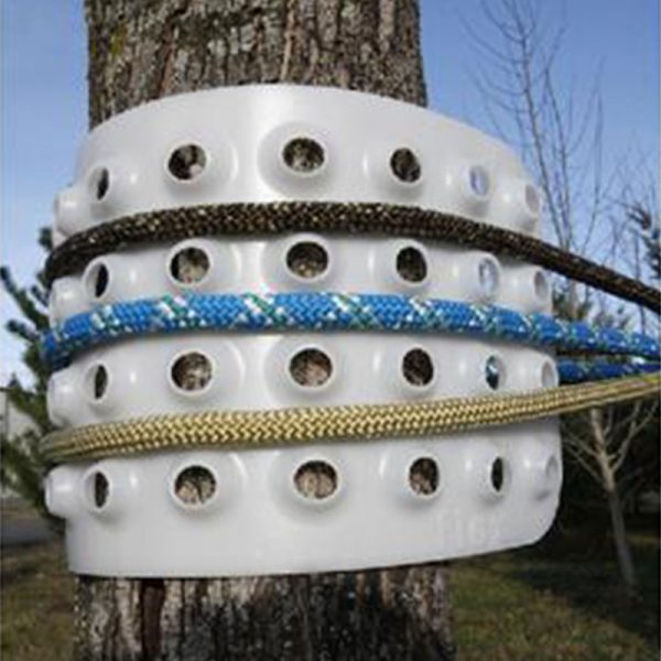 A white plastic BIG SHOT® Carrying Case is attached to a tree.