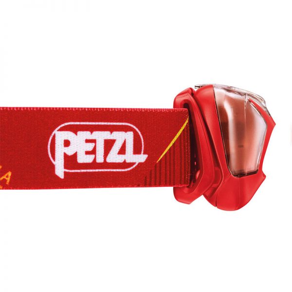 A petzl headlamp with a red strap.