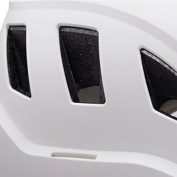 A close up of a white VERTEX® helmet with black vents.