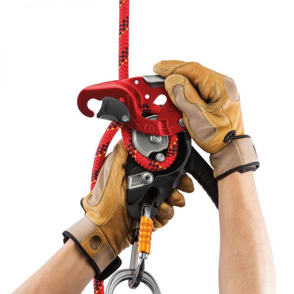 A person is holding an I’D® L with a hook attached to it.