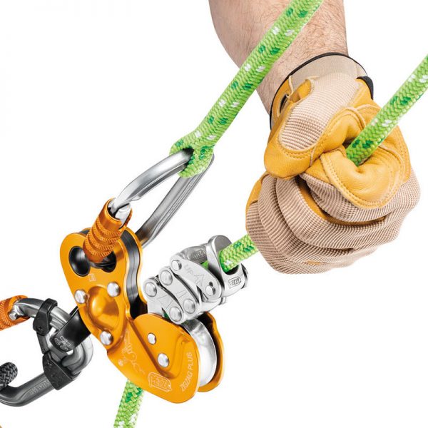A hand holding a ZIGZAG® and a harness.