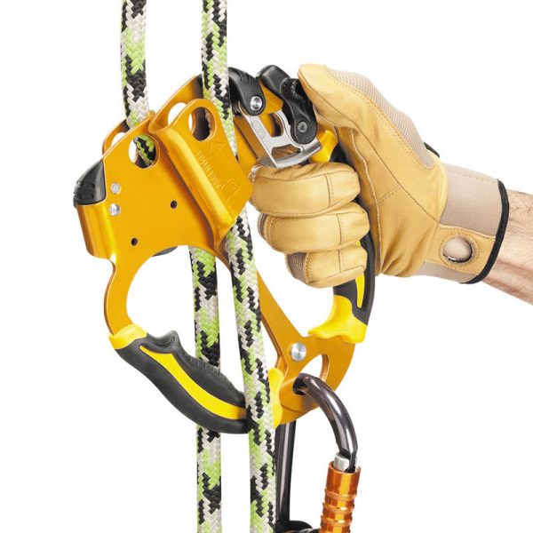 A person is holding a rope and a climbing carabiner.