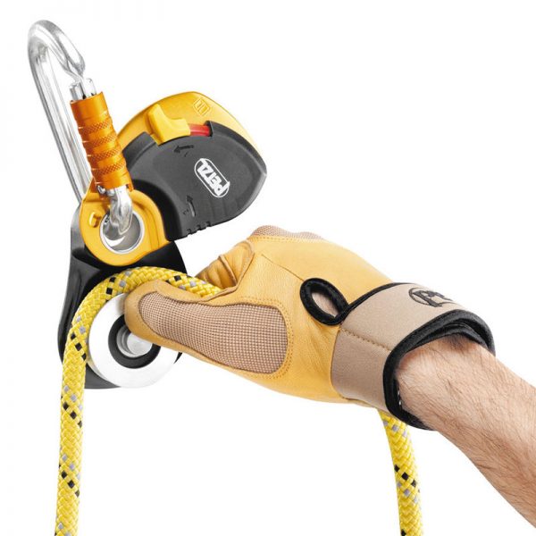 A hand holding a PRO TRAXION with a hook attached to it.