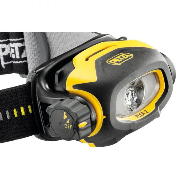A yellow and black headlamp with a strap.
