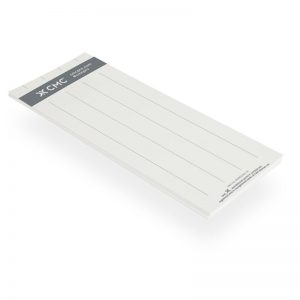 A FIELD GUIDE notepad on a white surface.