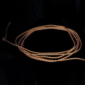 An orange rope on a black background.