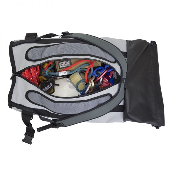 A large duffel bag with a lot of equipment inside.