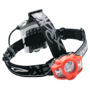 A headlamp with a red and black strap.