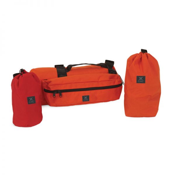 Two orange SYSTEM bags with black handles.