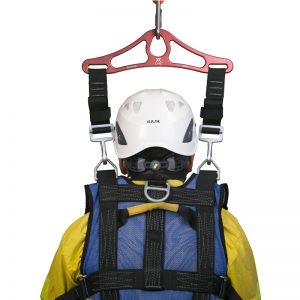 A person wearing a STRAP, CEARLEY RESCUE, CMC helmet and safety harness.