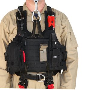 A man wearing a vest with a HARs 2.0 - Rescue Specialist Harness attached to it.