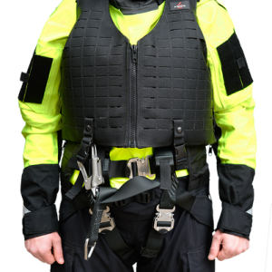 A man in a yellow vest, the TRITON PFD - fits LSC TRI-SAR and TRITON Harness, standing in front of a black background.