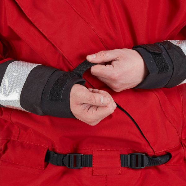 A man in an NRS Extreme SAR GTX Dry Suit is adjusting his wrists.